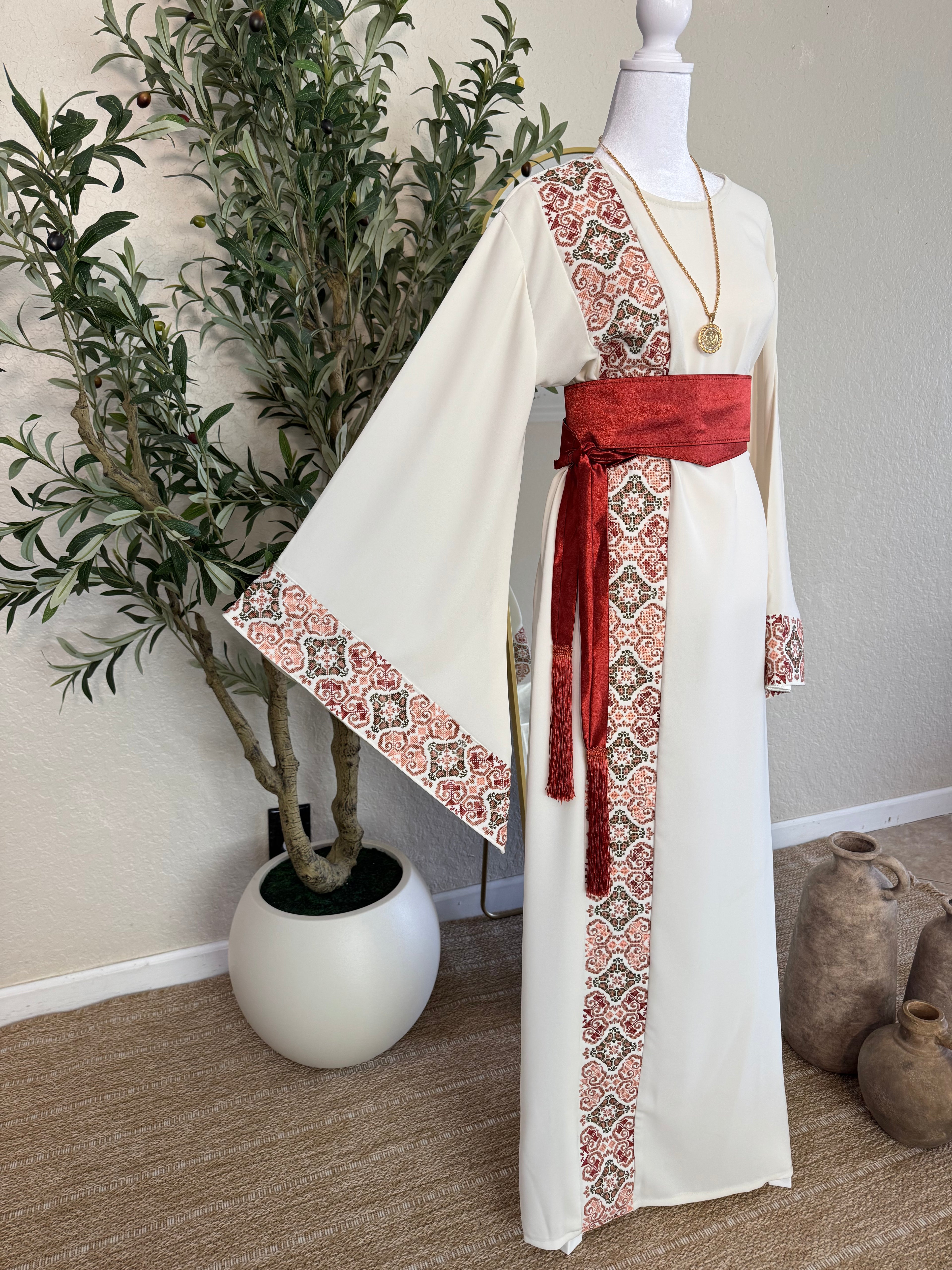 The Andalusian Abaya features elegant wide sleeves and intricate embroidery along the sleeve edges and front panel, accented with a rich red sash belt for luxury modest fashion.