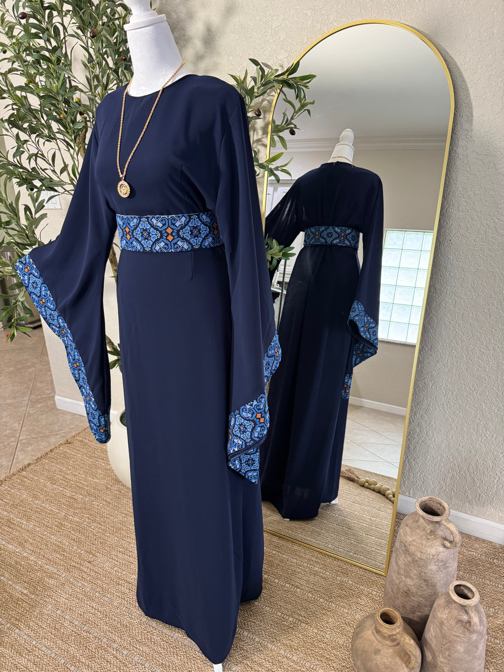 Back view of The Midnight Thoub with graceful flowing fabric and luxury modest design by Amira Designs