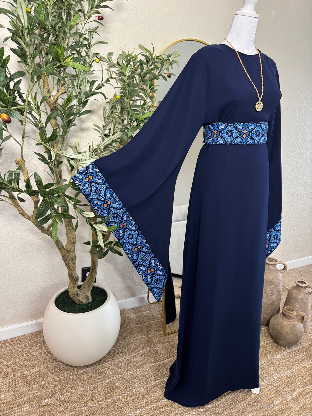 Side view of The Midnight Thoub showcasing elegant Palestinian embroidery and flowing modest silhouette