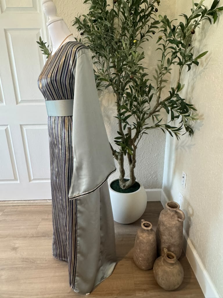 Amira Designs olive striped abaya with wide sleeves and matching belt, side view