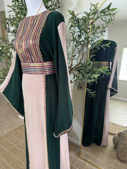 Side view of The Cedar Rose Thoub showcasing flowing modest silhouette and intricate Palestinian-inspired embroidery