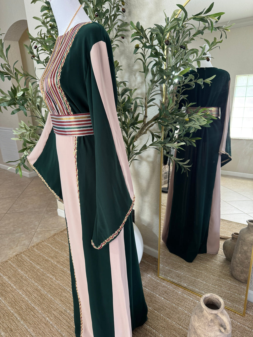 Back view of The Cedar Rose Thoub with graceful flowing fabric and timeless modest fashion design by Amira Designs