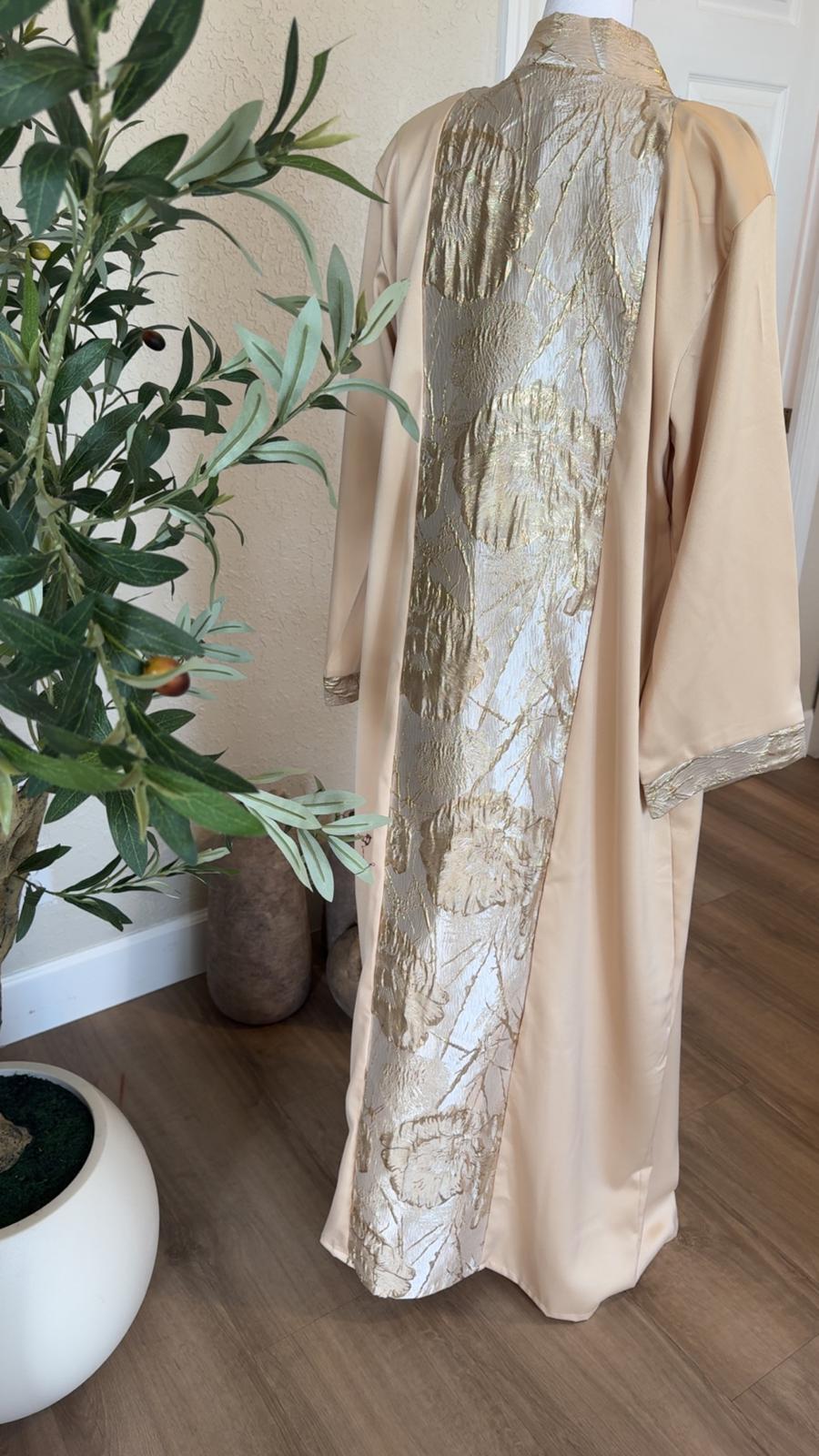 Back view of The Gilded Sand Palestinian Abaya with full-length metallic gold floral statement panel