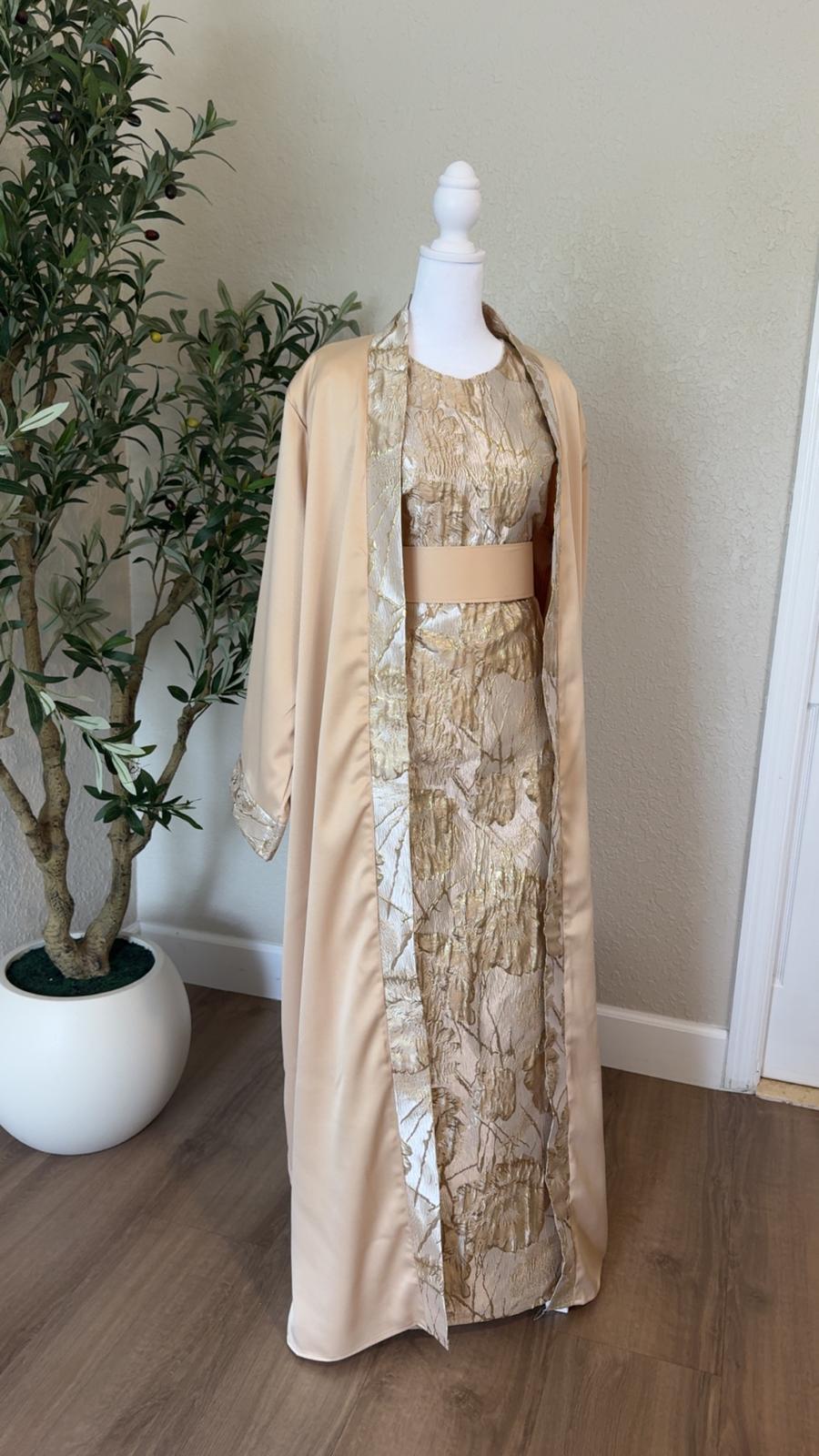 The Gilded Sand Palestinian Abaya in beige and metallic gold with coordinating waist belt