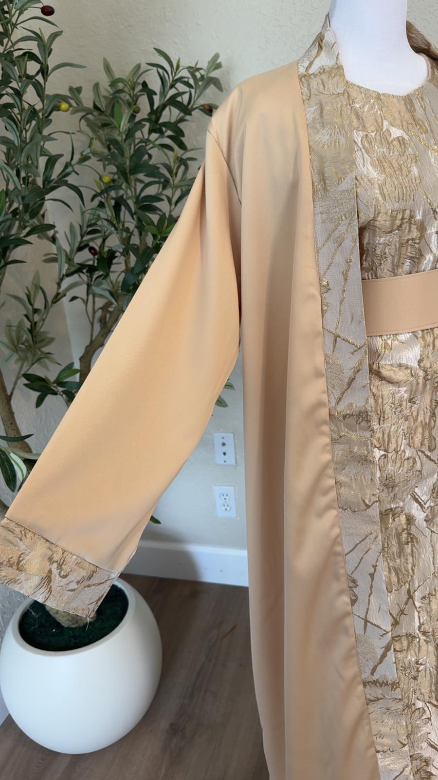 Close-up of metallic gold floral detailing and cuff on The Gilded Sand Palestinian Abaya