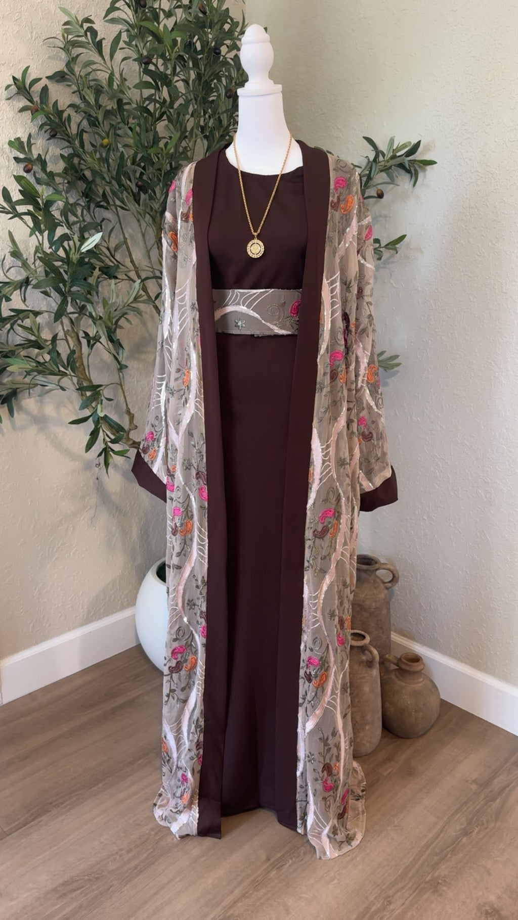 Hebron Rose Palestinian abaya in chocolate brown with floral embroidered outer layer and matching belt, made in Palestine