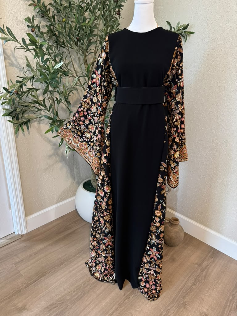 Jenin Garden black Palestinian thobe with colorful floral detailing, made in Palestine