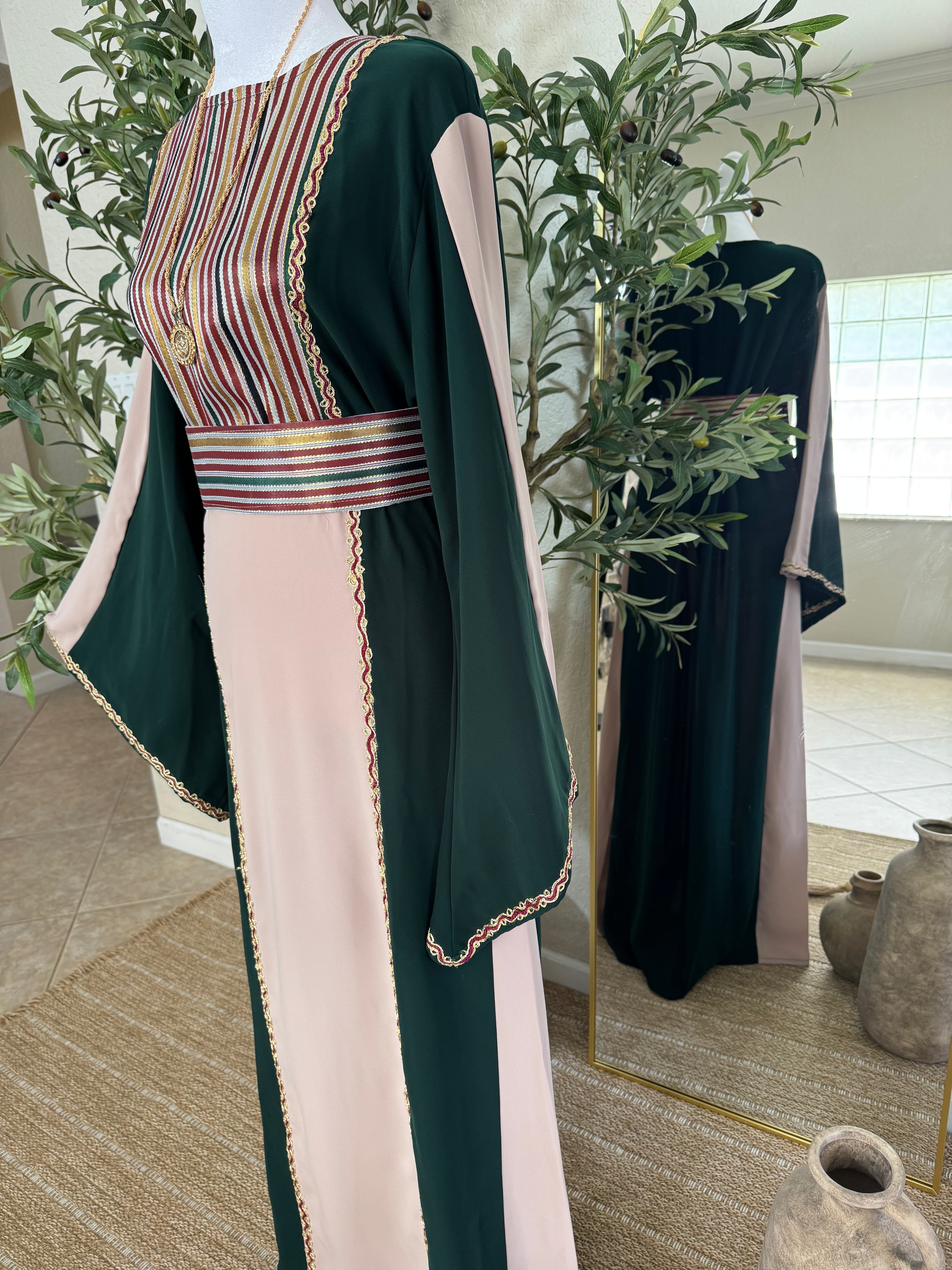Close-up detail of The Cedar Rose Thoub featuring Palestinian-inspired striped embroidery, elegant waist detailing, and luxurious modest craftsmanship by Amira Designs