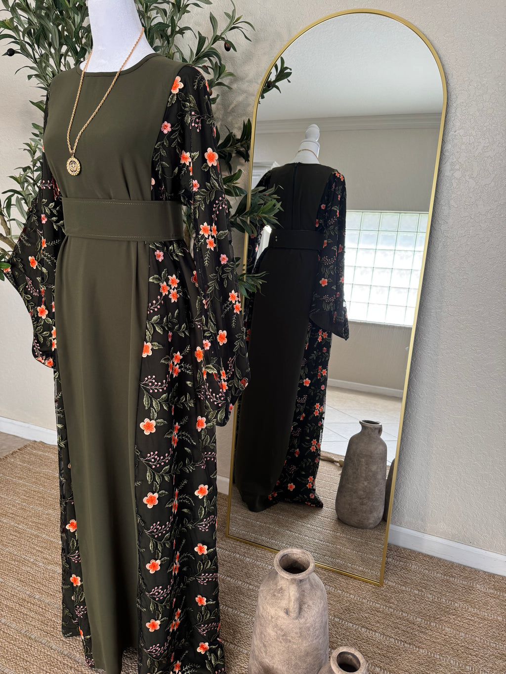 Elegant modest dress with black floral detailing and flowing sleeves by Amira Designs