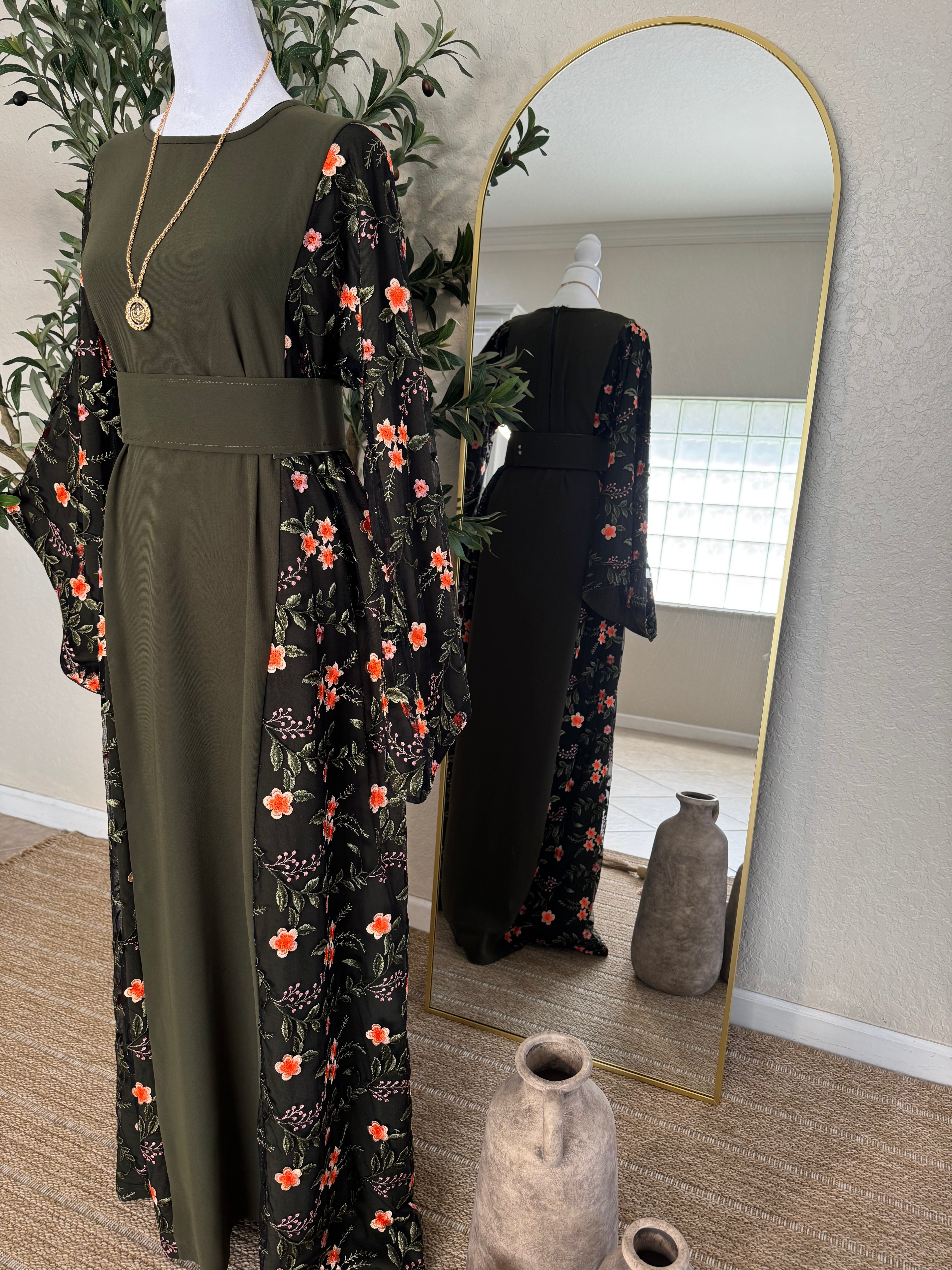 Elegant modest dress with black floral detailing and flowing sleeves by Amira Designs