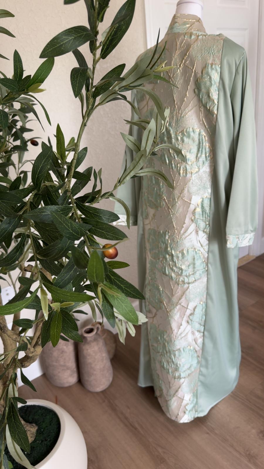 Back detail of Mint Pearl sage Palestinian abaya with ivory mint and gold floral panel, made in Palestine
