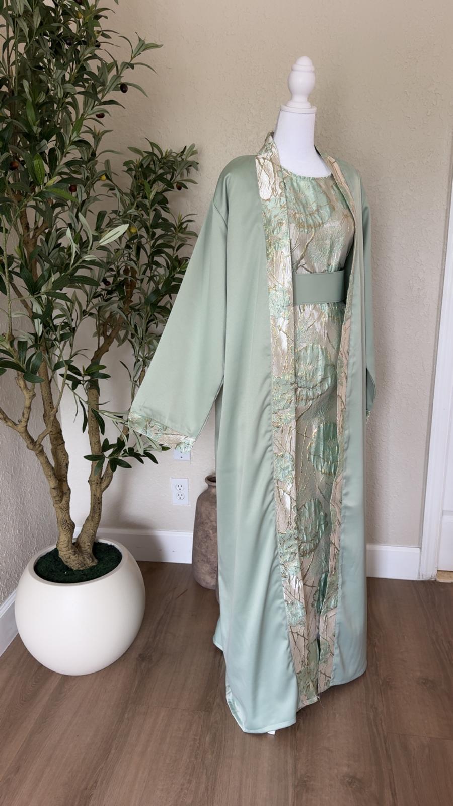 Mint Pearl sage green Palestinian abaya with ivory and gold floral detailing, made in Palestine
