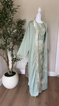 Mint Pearl sage green Palestinian abaya with ivory and gold floral detailing, made in Palestine
