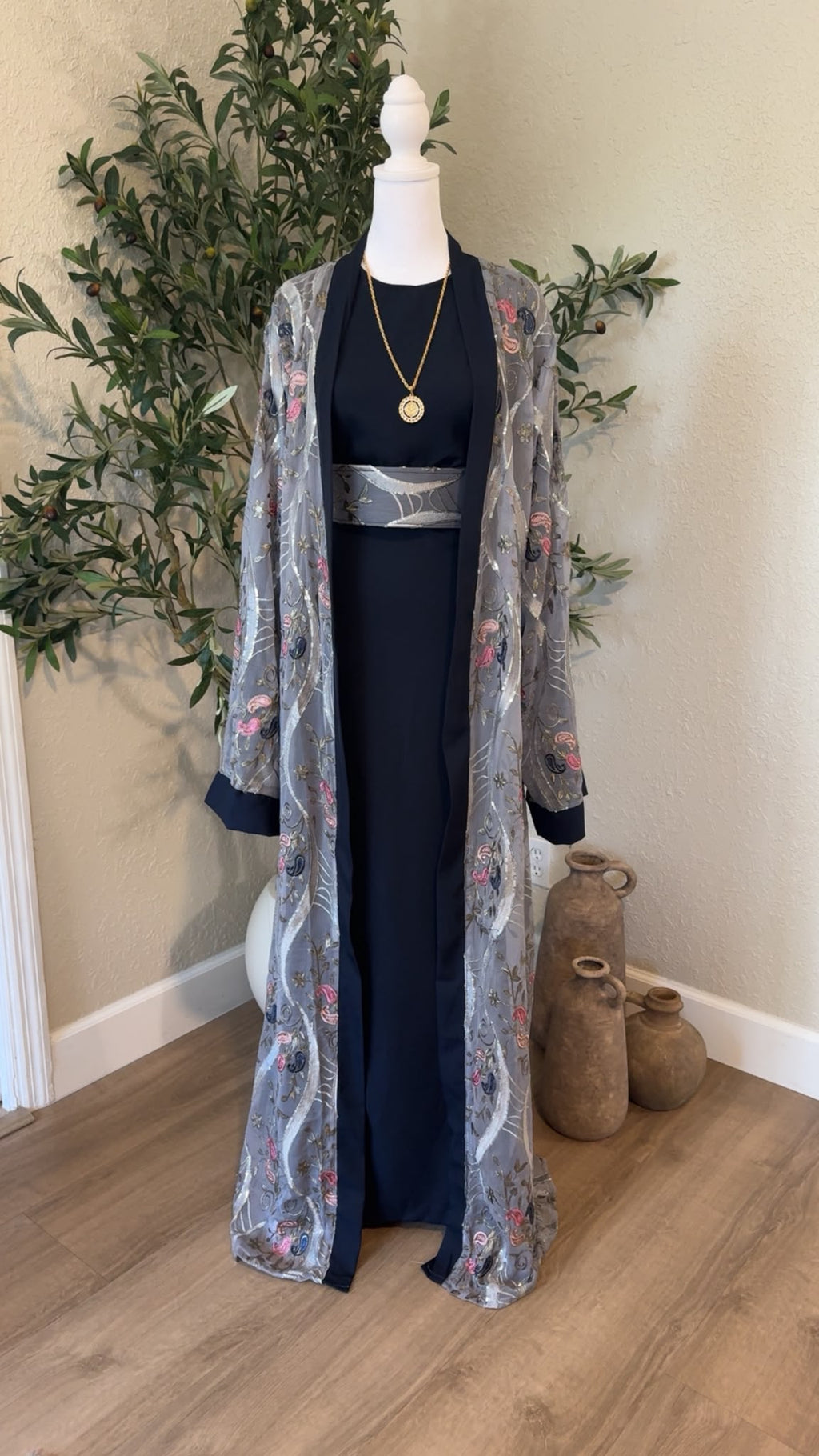 Nablus Night Palestinian abaya in navy blue with gray floral embroidered outer layer and matching belt, made in Palestine