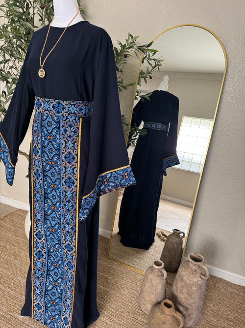 Elegant navy modest dress featuring intricate embroidered detailing and luxury wide sleeves