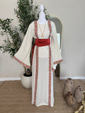 The Blush Heritage Thoub ivory modest dress with blush Palestinian inspired embroidery and flowing sleeves