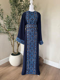 The Cobalt Heritage Thobe in navy with blue geometric front detailing and matching waist belt