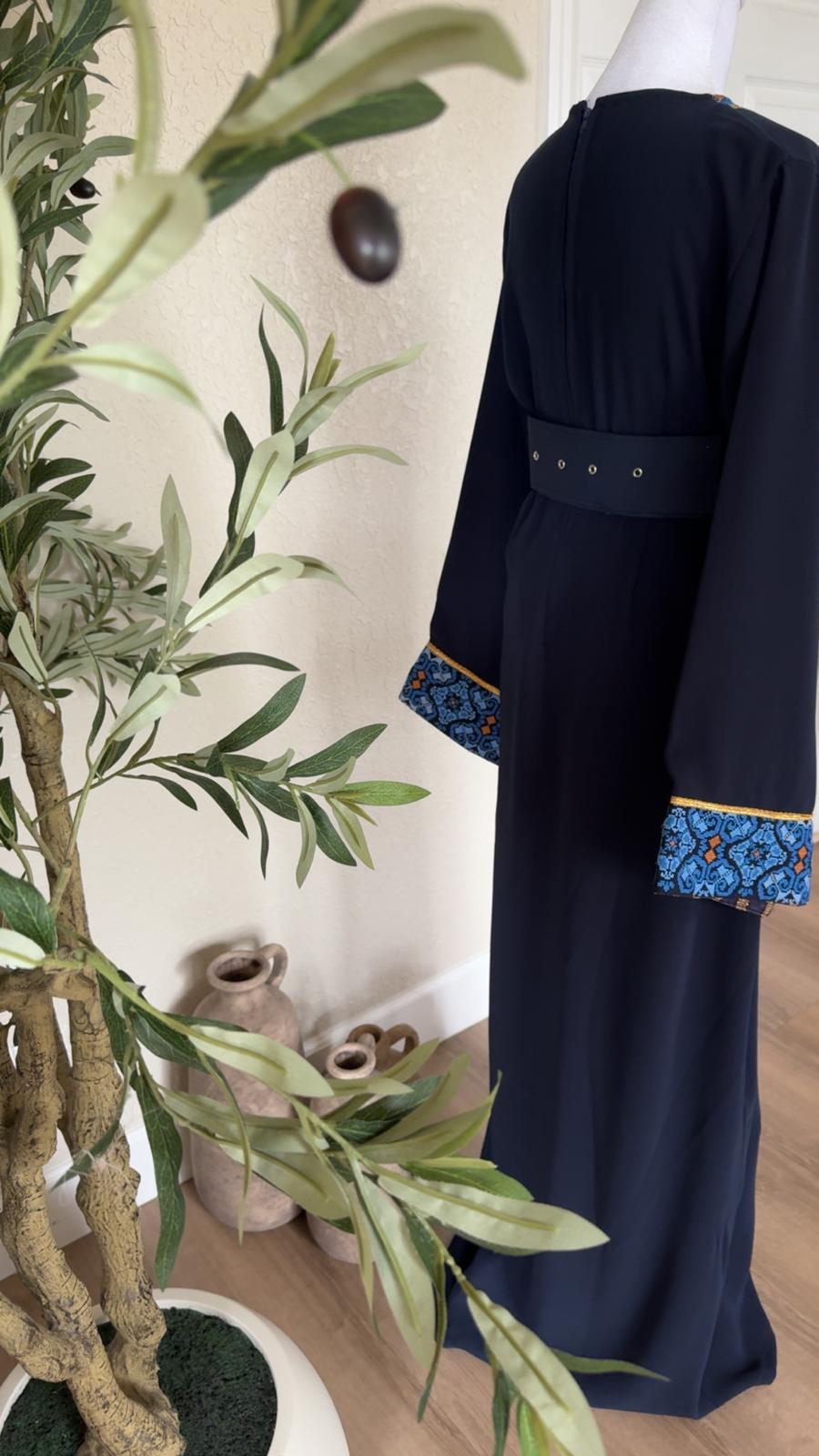 Back view of The Midnight Mosaic Thobe with navy belt and blue patterned cuffs
