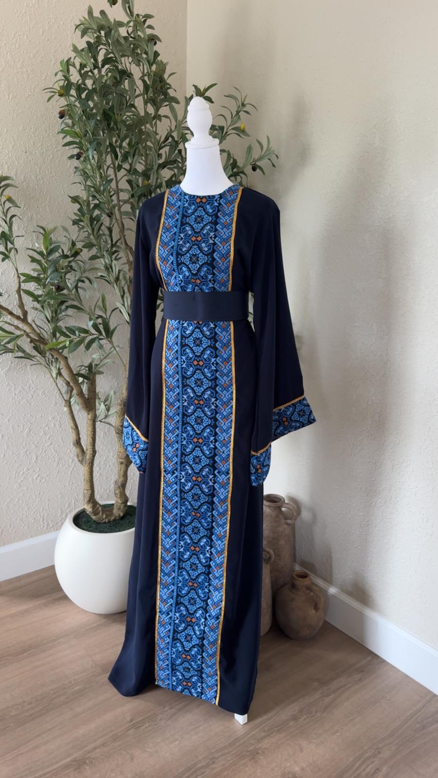 The Midnight Mosaic Thobe in navy with blue geometric detailing and matching waist belt