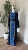 The Midnight Mosaic Thobe in navy with blue geometric detailing and matching waist belt
