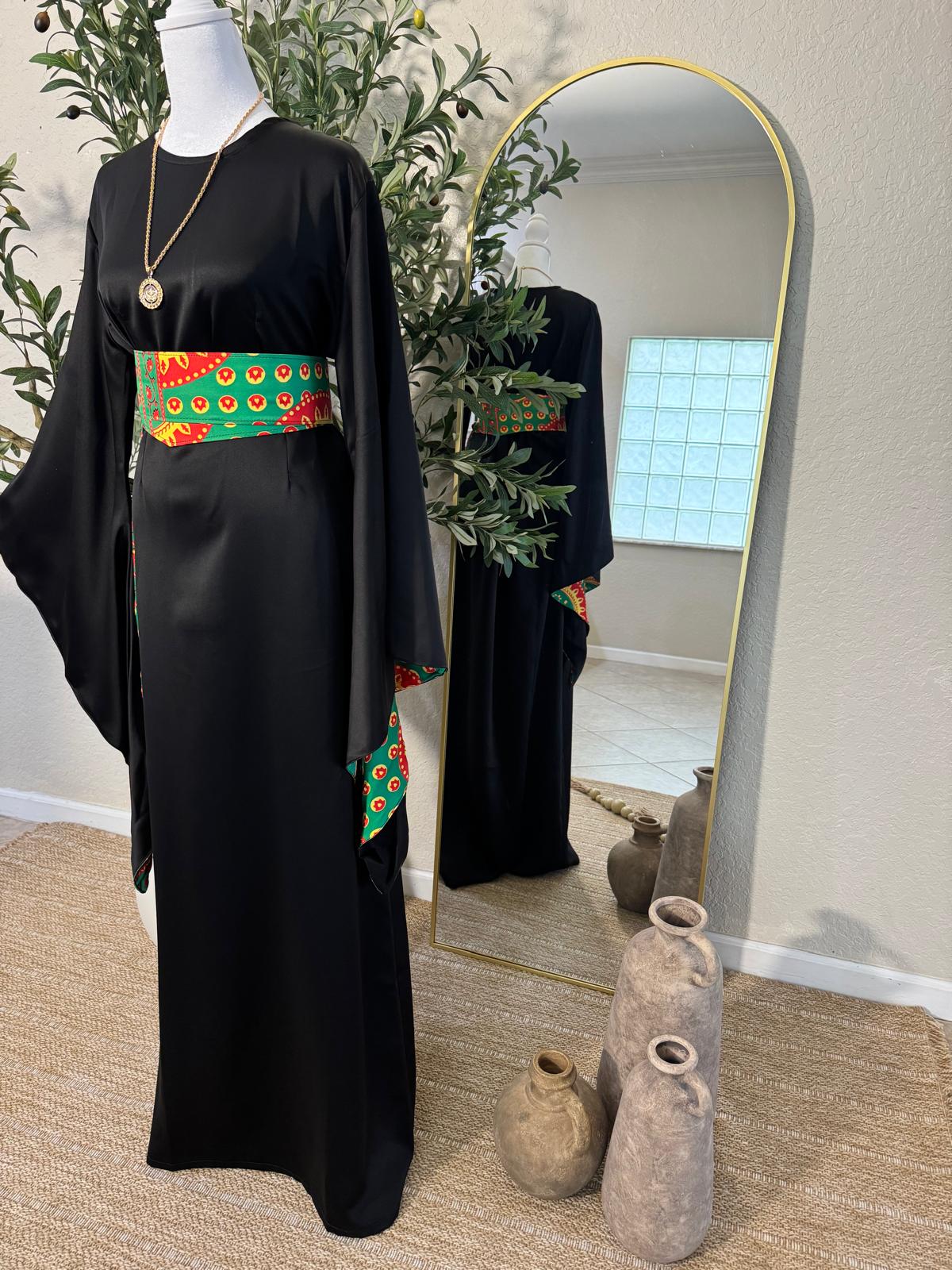 Elegant modest satin dress featuring flowing sleeves and traditional embroidered detailing